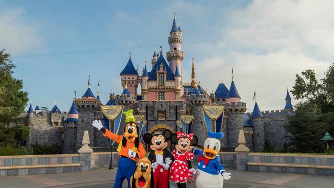 Standing in front of Sleeping Beauty Castle at California’s Disneyland Park, Mickey Mouse, Minnie Mouse and their pals welcome visitors from all over the world. (Joshua Sudock/Disneyland Resort)