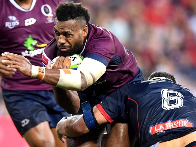 BRISBANE, AUSTRALIA - MARCH 30: Samu Kerevi of the Reds   takes on the defence during the round seven Super Rugby match between the Reds and the Rebels at Suncorp Stadium on March 30, 2019 in Brisbane, Australia. (Photo by Bradley Kanaris/Getty Images)