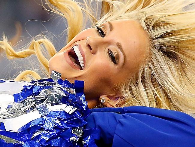 ARLINGTON, TX - JANUARY 04: The Dallas Cowboys Cheerleaders perform during the first half of their NFC Wild Card Playoff game against the Detroit Lions at AT&T Stadium on January 4, 2015 in Arlington, Texas. Tom Pennington/Getty Images/AFP == FOR NEWSPAPERS, INTERNET, TELCOS & TELEVISION USE ONLY ==