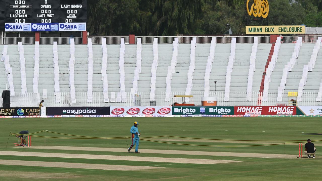 Sad scenes as technicians remove the wickets at the Rawalpindi Cricket Stadium. Photo by Aamir QURESHI / AF