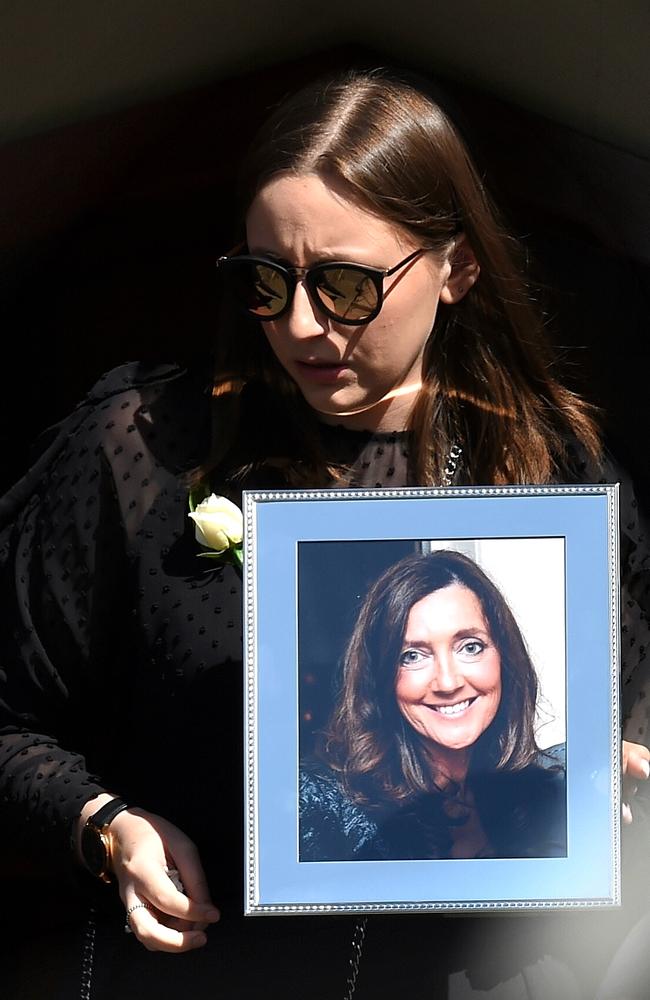 Sarah Ristevski left the church first, carrying a photograph of her mum. Picture: Nicole Garmston