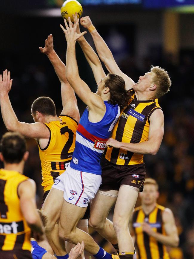 Hawks defender James Sicily spoils Marcus Bontempelli on Friday night. Picture: Getty Images