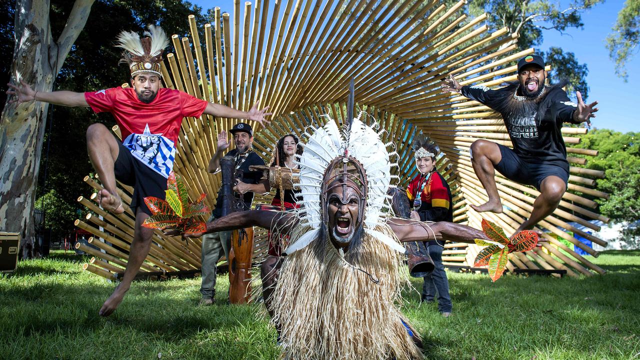 Sorong Samarai band members Sam Roem, Airileke Ingram, Mea Ingram, Albert David, Raga Ingram and Yosua Roem in front of the Tasku bamboo installation at Womadelaide in Botanic Park. Picture: Mark Brake