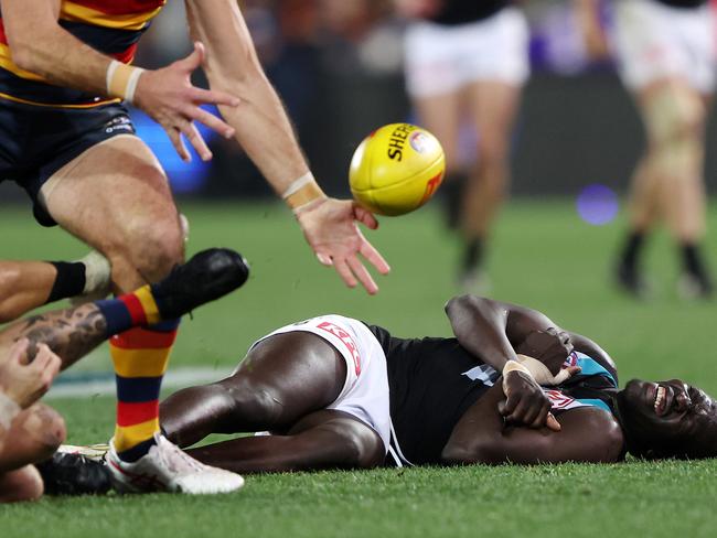 ADELAIDE, AUSTRALIA - JULY 29: Aliir Aliir of the Power down after a collision with Lachie Jones of the Power during the 2023 AFL Round 20 match between the Adelaide Crows and the Port Adelaide Power at Adelaide Oval on July 29, 2023 in Adelaide, Australia. (Photo by Sarah Reed/AFL Photos via Getty Images)