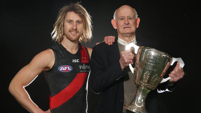 Dyson Heppell wears the Bombers Heritage jumper with Essendon 1965 premiership captain Ken Fraser. Picture: Michael Klein