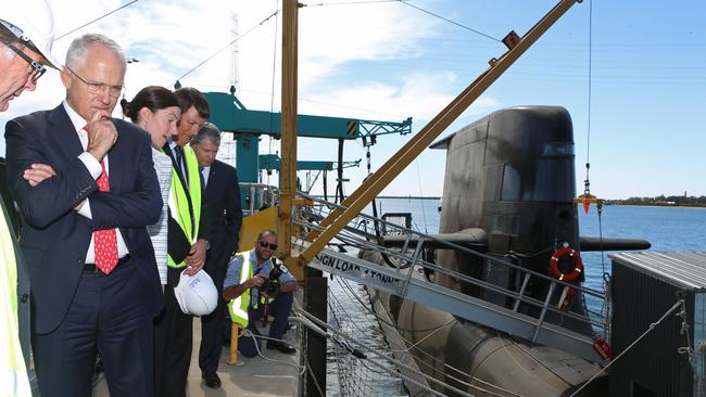 Australian Prime Minister Malcolm Turnbull looks at a Royal Australian Navy Collins-class submarine at the ASC naval shipyards in Adelaide. Picture: James Knowler/AFP