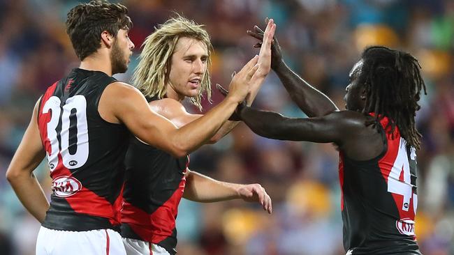 Kyle Langford, Dyson Heppell and Anthony McDonald-Tipungwuti celebrate a goal.