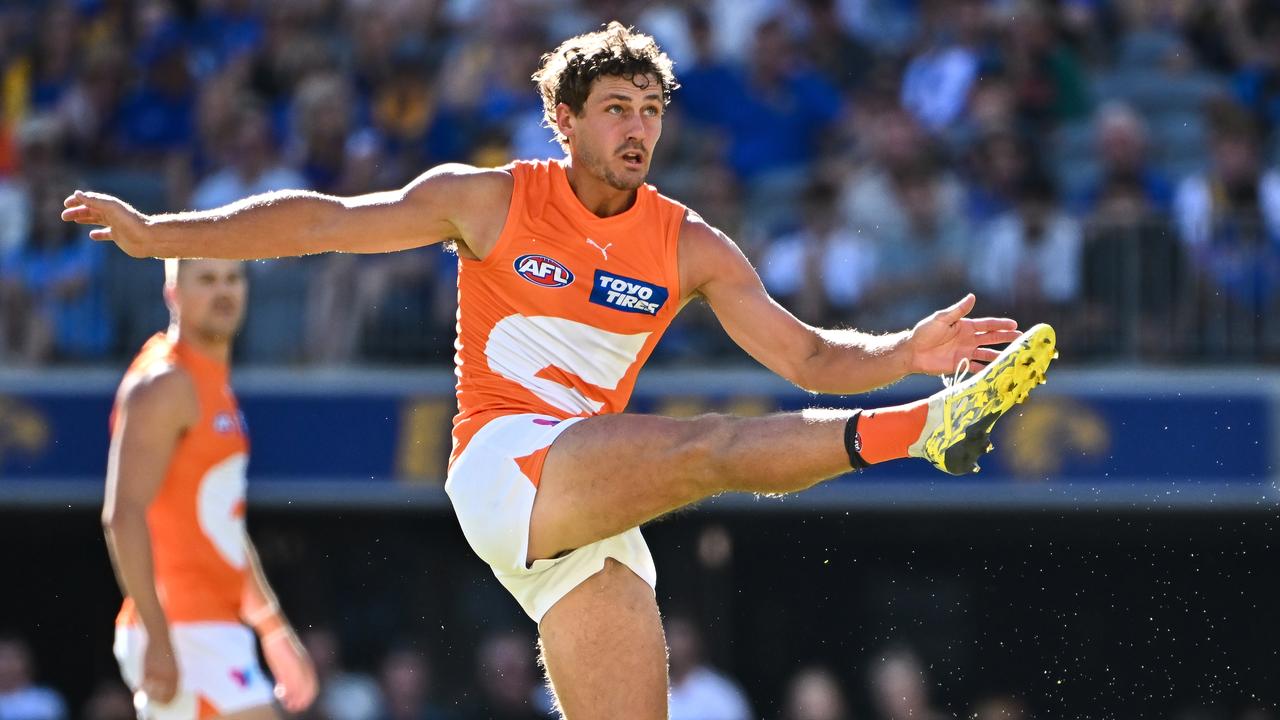 PERTH, AUSTRALIA - MARCH 24: Harry Perryman of the Giants kicks the ball during the 2024 AFL Round 02 match between the West Coast Eagles and the GWS GIANTS at Optus Stadium on March 24, 2024 in Perth, Australia. (Photo by Daniel Carson/AFL Photos via Getty Images)