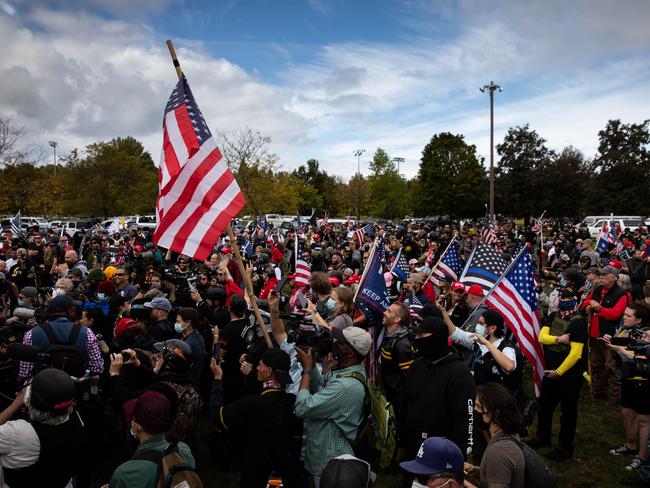 Several hundred members of the Proud Boys and other similar groups at a rally to support Donald Trump. Picture: AFP.