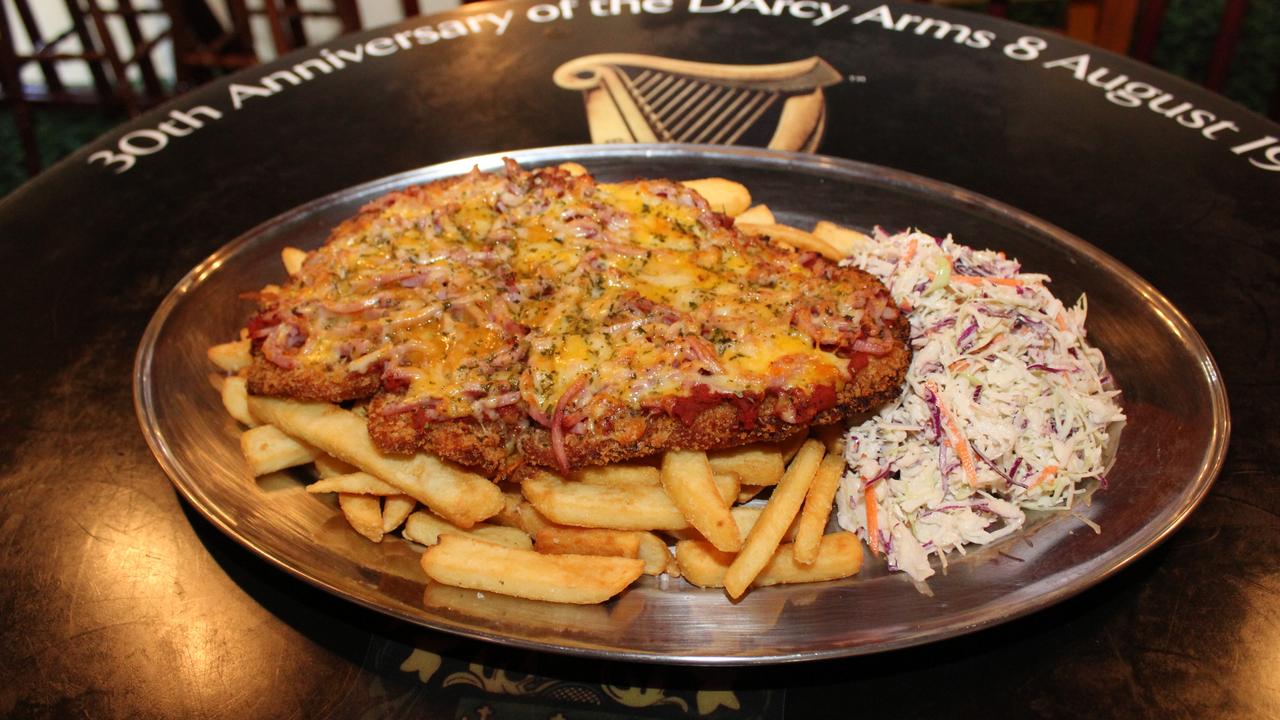 The entire 1.8kg feast consists of a super-sized chicken parmigiana on top of a pile of chips and a decent serving of coleslaw.