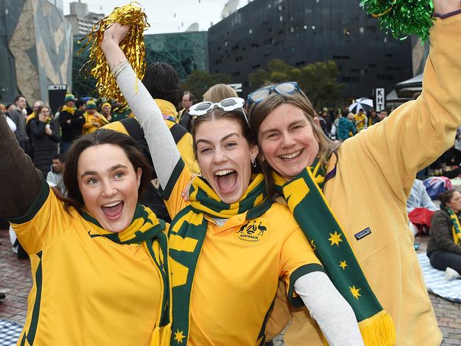 MELBOURNE, AUSTRALIA - NewsWire Photos, AUGUST 12, 2023. Matlidas fans arrive early at Federation Square to watch the free broadcast of the FIFA WomenÃs World Cup 2023Âª quarter-final showdown against France on the big screen. (L-R) Lulu Pye, Pia Aiken and Mette Aiken. Picture: NCA NewsWire / Josie Hayden