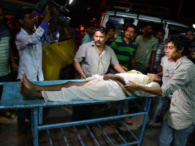 Injured ... Indian staff at Siliguri Hospital help a victim injured during an earthquake in Siliguri.  Picture:  AFP