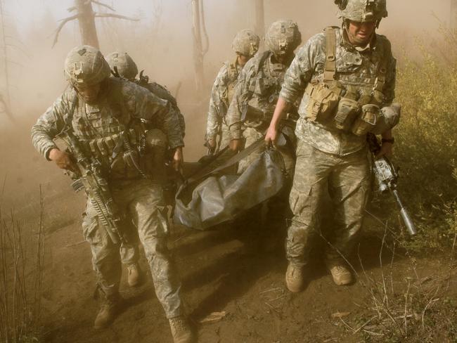 Soldiers carrying the body of their sergeant in the Korangal Valley following a Taliban ambush. Picture: Lynsey Addario