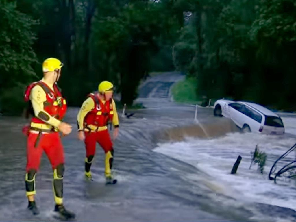 A submerged car has been washed off a bridge in Caboolture., Just a few inches of water picked up the Holden Commodore and moved it downstream after it became stuck early this morning. Picture 7News