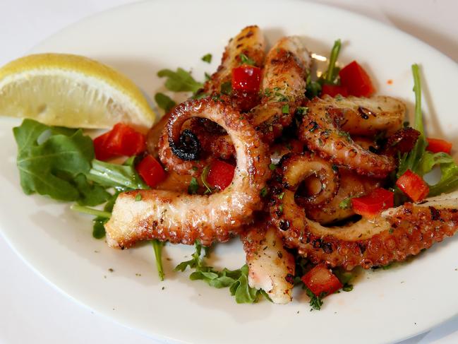 Thaleia Greek restaurant in Beverly Hills has been chosen as the best Greek restaurant in Western Sydney. Owner Josip Devcic pictured with an entree of octopus and main course of lamb. Picture: Toby Zerna