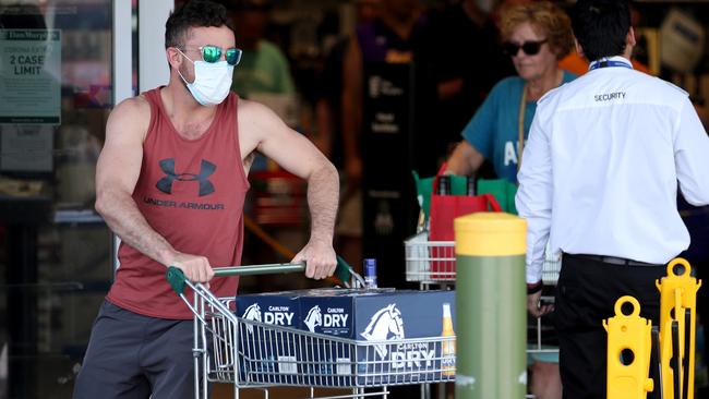 An Adelaide resident stocks up at Dan Murphy’s in Hindmarsh on Wednesday, ready for the six-day lockdown. Picture: Getty Images