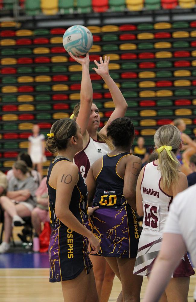 Netball action at QISSN 2024 held in Townsville. Clairvaux Mackillop College v St Joseph's College