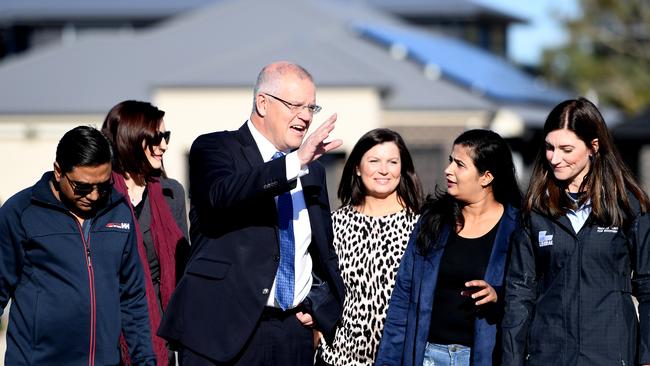 Scott Morrison (C) with his wife Jenny (centre right) and the Federal Member for Boothby Nicolle Flint (R) . Picture: Getty Images.