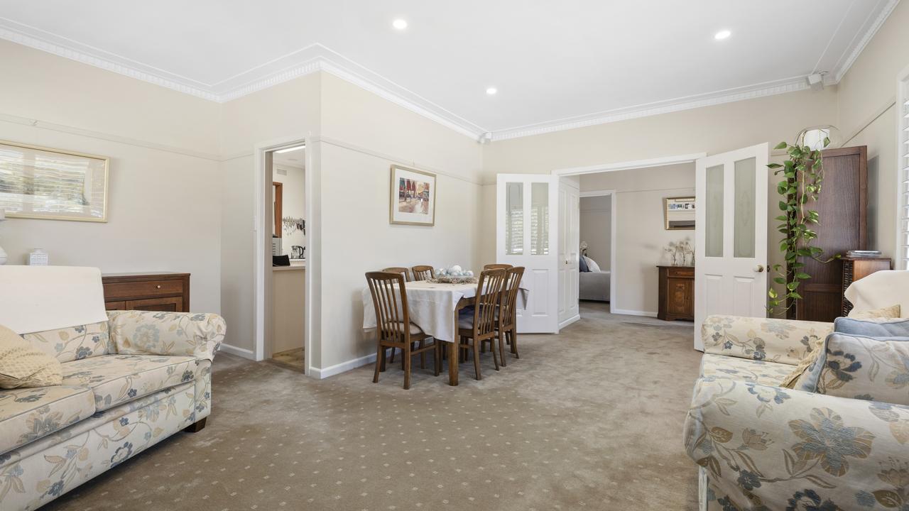 The lounge and dining area at the front of the abode.