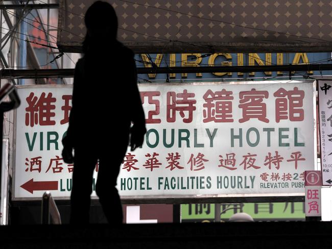 A sign for an "hourly hotel" allegedly used for sexual encounters in a popular shopping district in Hong Kong. Picture: Antony Dickson