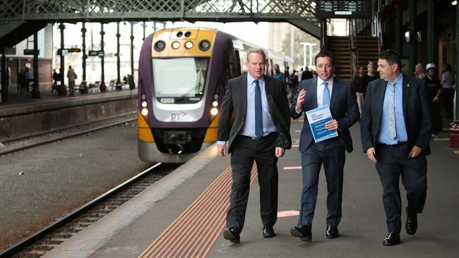 Opposition Leader Matthew Guy, with Liberal candidates Brian McKiterick and Andrew Katos, at Geelong Train station. Picture: Alison Wynd