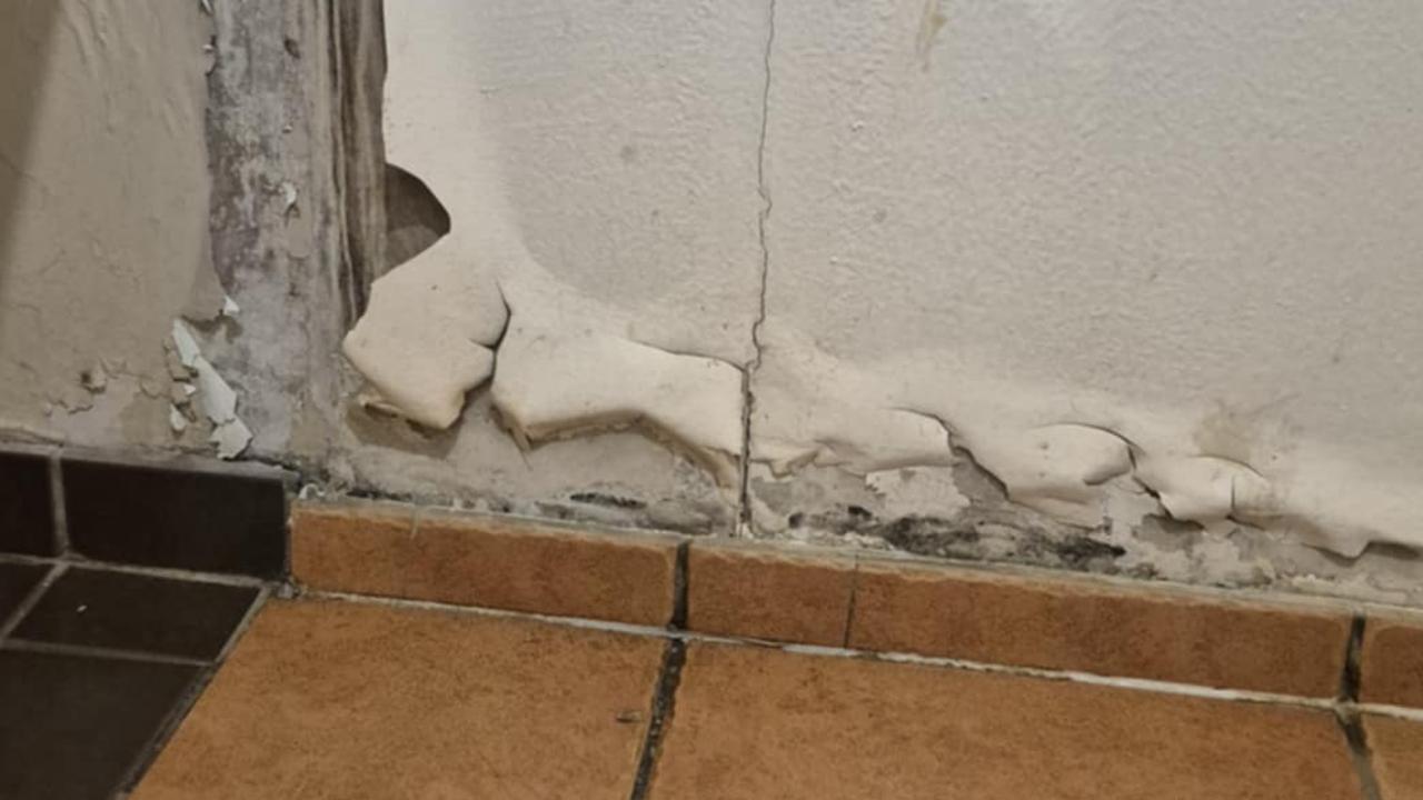 Guests claim living in the the central hostel is like living in a prison. Walls in one of the he bathrooms appears to be covered in mould.