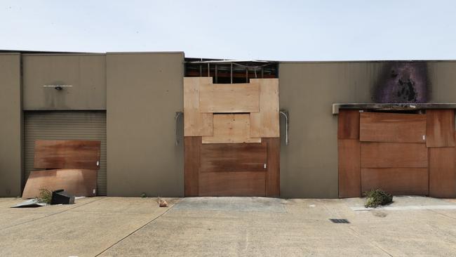 The boarded up shell of Silks brothel at Bundall after fire destroyed the premises. Picture Glenn Hampson