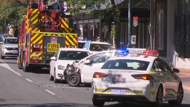 A woman has allegedly tried to run a man down before crashing her car onto a busy North Adelaide footpath. Picture: NINE NEWS