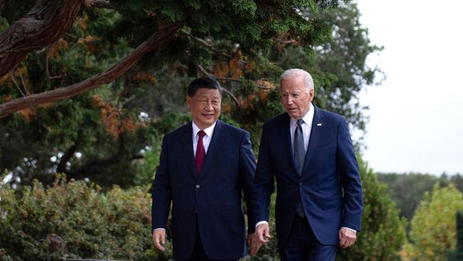 US President Joe Biden (R) and Chinese President Xi Jinping walk together after a meeting during the Asia-Pacific Economic Cooperation (APEC) Leaders' week in Woodside, California on November 15, 2023. Picture: Brendan Smialowski / AFP