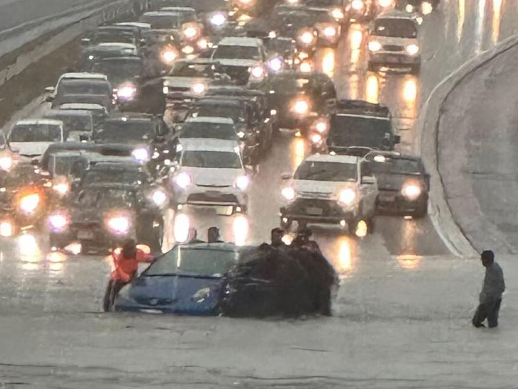 A car trapped in flooding on Auckland’s northern motorway. Picture: Supplied