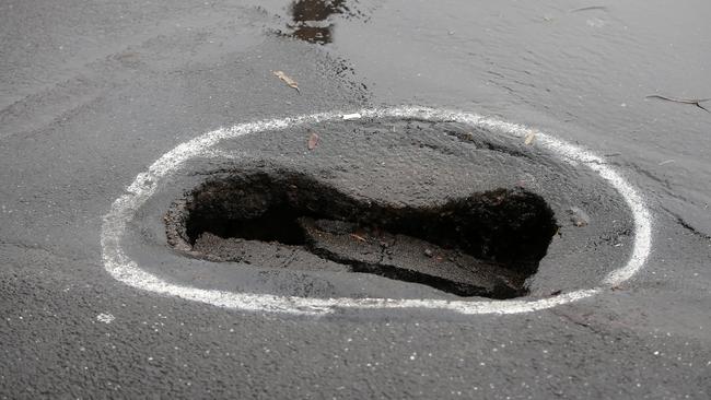 A sinkhole on Myers St near the Haymarket carpark. Picture: Alison Wynd