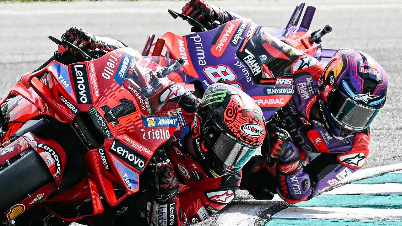 Bagnaia and Martin staged a scrap for the ages in the opening laps on Sunday. (Photo by MOHD RASFAN / AFP)