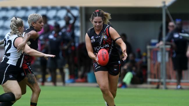 Tiwi Bombers Rhiannon Busch pushes the ball forward in the NTFL 22/23 season opener against Palmerston Magpies. Picture: (A)manda Parkinson