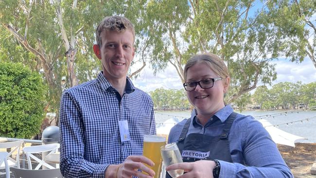 Pretoria Hotel venue manager Brad Harper and staff member Chloe Underwood celebrate the reopening of the popular Mannum hotel. Picture: Dylan Hogarth