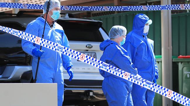 Queensland Police at the family home in Arundel where Robert Lumsden was allegedly killed.