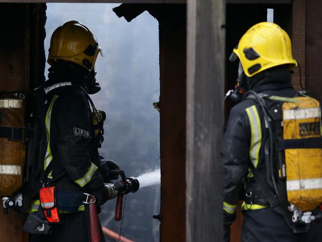 London Fire Brigade firefighters control a fire that broke out at a cafe and shop at London Zoo.  Picture:  AFP