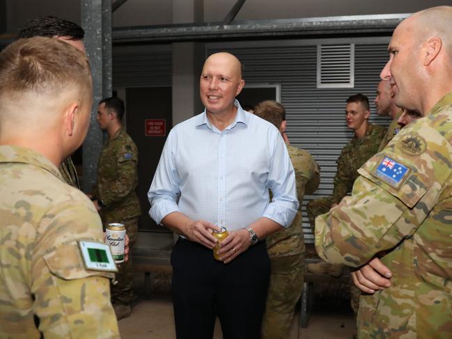 Minister for Defence Peter Dutton speaks with military personnel at Lavarack Barracks in Townsville on Thursday night, April 8, 2020. , , Picture: Max Bree