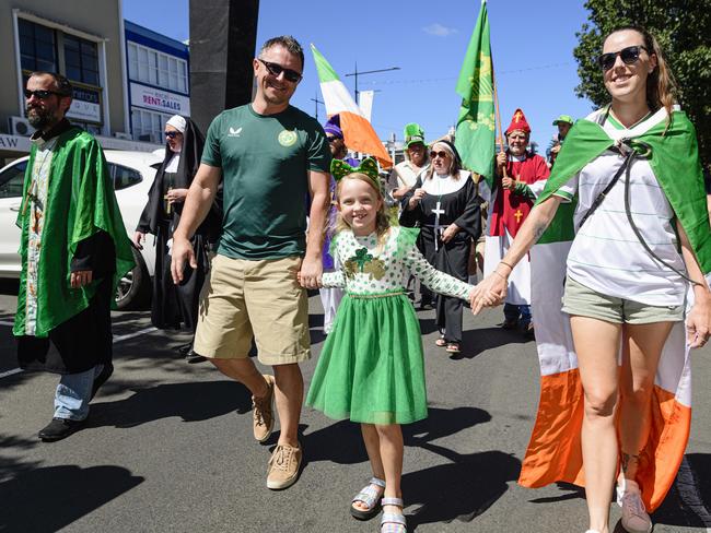 Marching in the Darling Downs Irish Club St Patrick's Day parade are (from left) Derek Barker, Orla Barker and Meaghan Moore, Sunday, March 16, 2025. Picture: Kevin Farmer