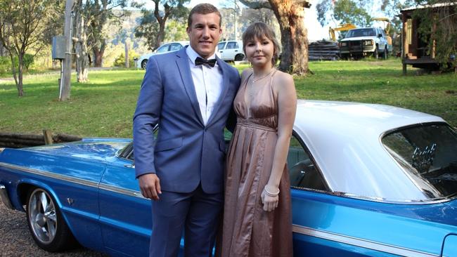 Newcastle Knights player, Trent Hodkinson with teenager Hannah Rye on her way to her school formal.. Source: Supplied