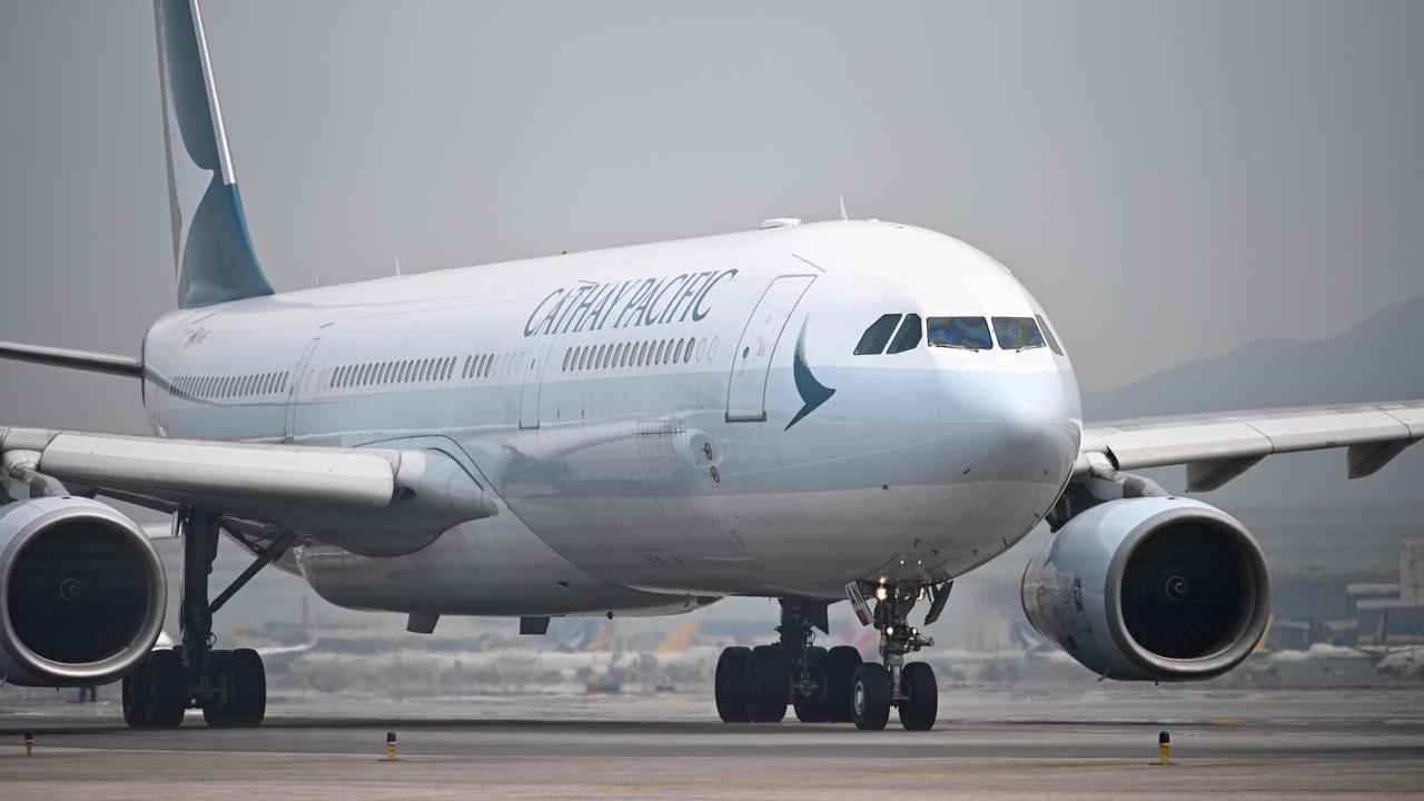 Cathay Pacific has fired three flight attendants after complaints they allegedly mocked non-English speaking passengers. Picture: Anthony Wallace/AFP