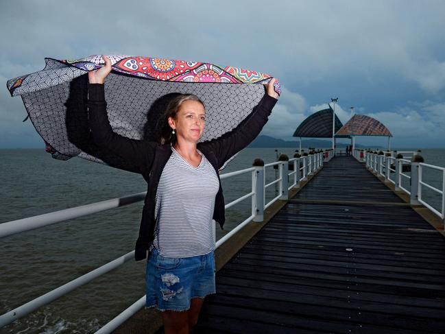 Nicky Bowen on the Strand, Townsville, awaits Cyclone Kimi. Picture Scott Radford-Chisholm