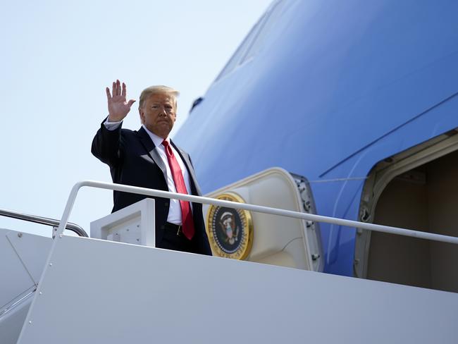 President Donald Trump waves as he boards Air Force One for a trip to Arizona to visit the border. Picture: Evan Vucci