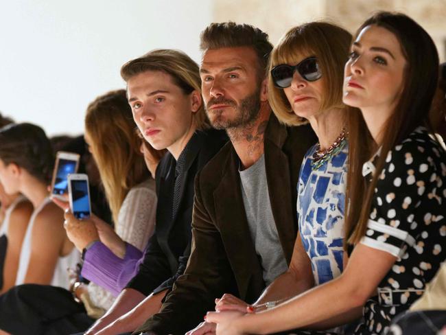 David Beckham and his son Brooklyn and Vogue magazine editor Anna Wintour with daughter Bee Shaffer attend the Victoria Beckham Spring Summer 2017 show on September 11, 2016 at New York Fashion Week. Picture: AFP
