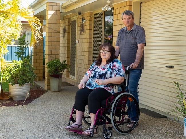 Jennifer Arnold relies on a wheelchair and care from her husband Mark Jenkins after a spine surgeon she claims went wrong in 2018.