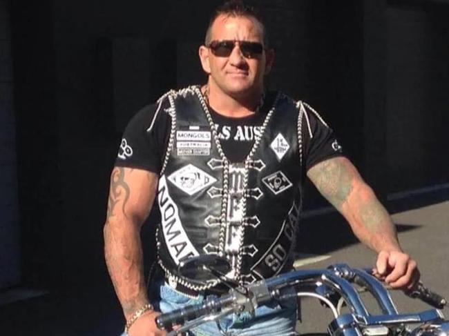 Outlaw Motorcycle Gang member Shane Bowden was shot 21 times in his garage by two men who fled to a waiting Holden Commodore.