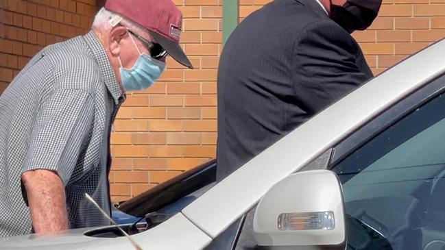 John Vincent Lewis hunched over outside Hervey Bay District Court