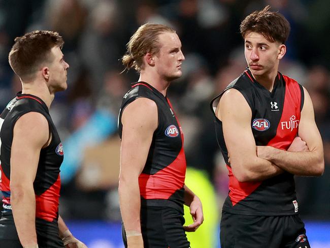 GEELONG, AUSTRALIA - JULY 15: Bombers look dejected after the loss during the round 18 AFL match between Geelong Cats and Essendon Bombers at GMHBA Stadium, on July 15, 2023, in Geelong, Australia. (Photo by Kelly Defina/Getty Images)