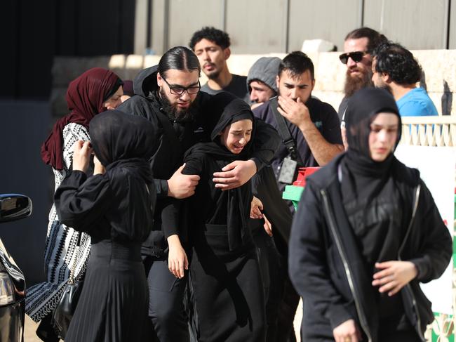 Mourners at the funeral.