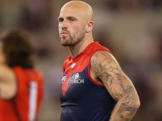 MELBOURNE, AUSTRALIA - APRIL 05: Nathan Jones of the Demons (C) looks dejected after defeat during the round three AFL match between the Melbourne Demons and the Essendon Bombers at Melbourne Cricket Ground on April 05, 2019 in Melbourne, Australia. (Photo by Michael Dodge/Getty Images)