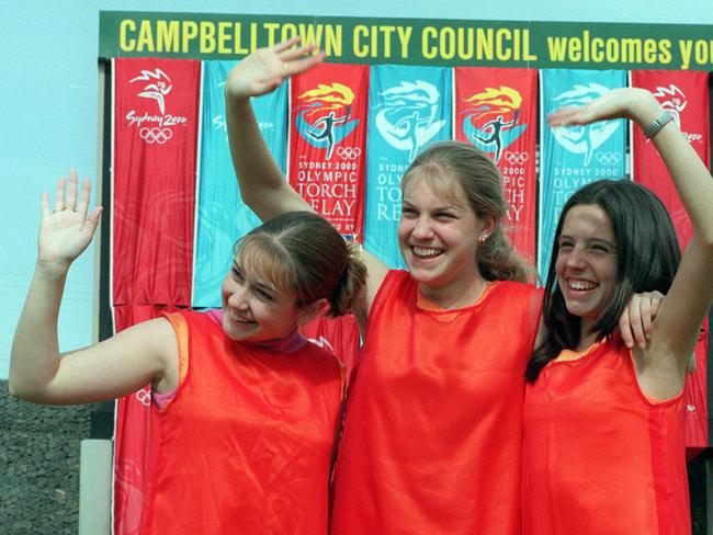 St (Saint) Patricks College students Kathryn Harris, Stephanie Symkowiak and Michelle Loomes welcomed the flame to Campbelltown on on September 4 Picture: Stephen Cooper